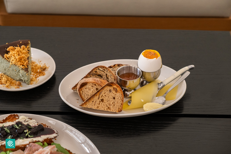 Bread and Butter Plate with 2 types of sourdough, soft boiled egg and butter, salt and cheese