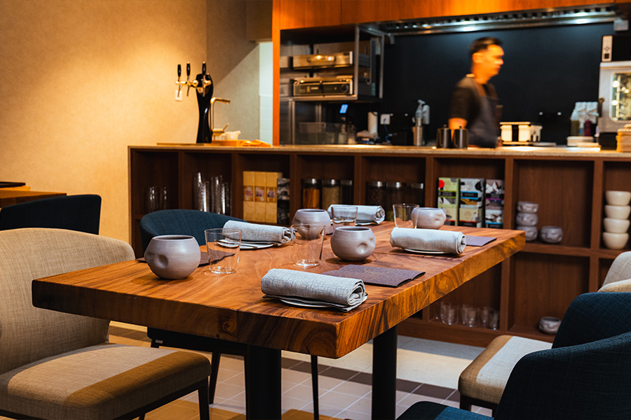 Interior of Assaggi, tables with direct view of the open kitchen