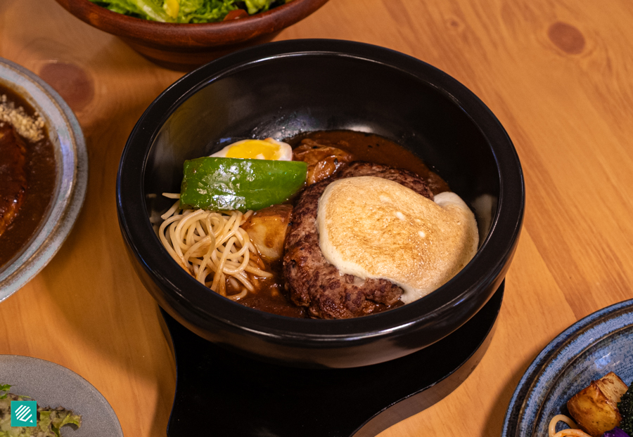 Yamamoto Hamburg beef patty in miso-dashi demi-glace, cut open to show the Gorgonzola filling